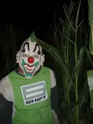 Green Creepy Clown Character in Terror in the Corn Cornfield