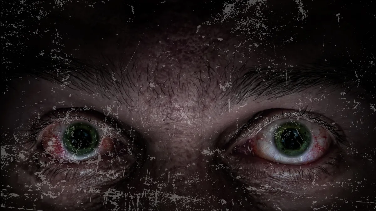 Close-up Image of Mans Face with Bloodshot Eyes