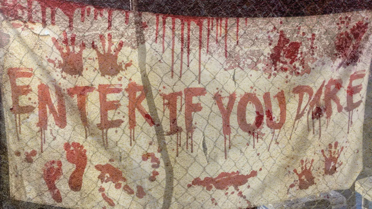 Bloody Enter if You Dare Sign Hung on Fence at Tucson Terror at the Corn